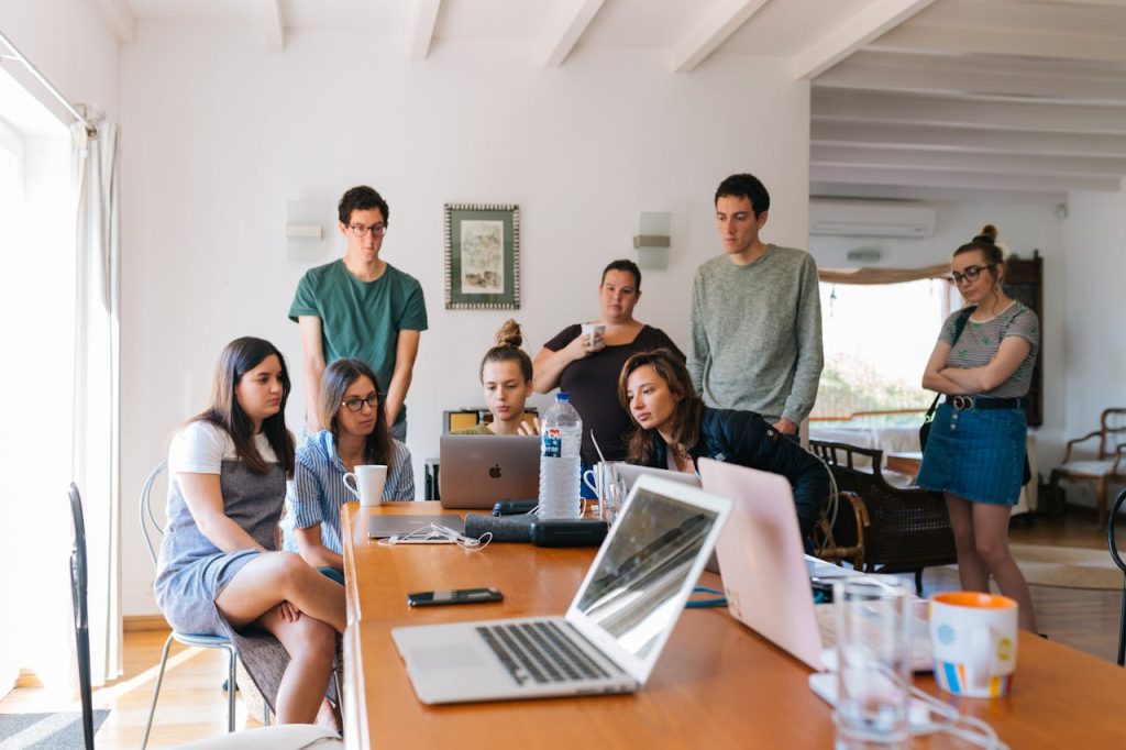 pexels photo 1595385 Group of young professionals engaged in a collaborative meeting in a modern office setting.